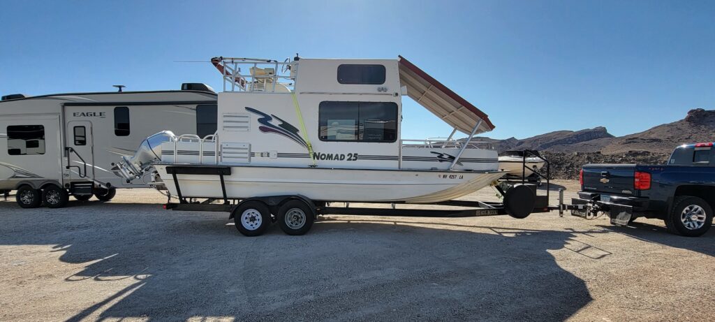 Towable houseboat on trailer